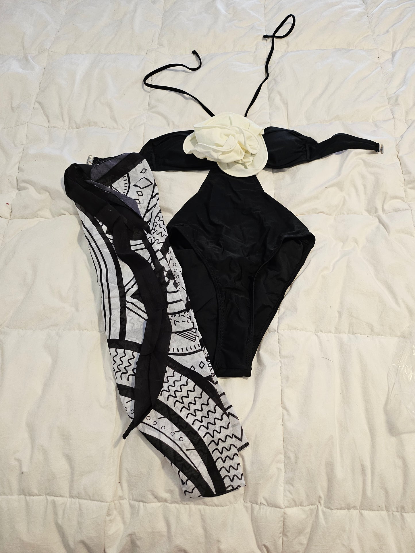 Small black and white bathing suit with wrap around cover up